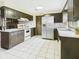 Traditional kitchen with white appliances and spacious countertops at 1209 S Rangeline Rd, Anderson, IN 46012