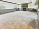 Spacious carpeted living room with brick fireplace and natural light at 1209 S Rangeline Rd, Anderson, IN 46012