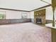 Cozy living room with brick fireplace and wood beam accents at 1209 S Rangeline Rd, Anderson, IN 46012
