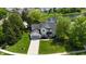 Beautiful two-story home features a well-kept lawn with mature trees and a pond view at 12115 Flagstone Dr, Fishers, IN 46037
