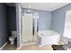 Bathroom showcasing a shower and tub with natural light at 12115 Flagstone Dr, Fishers, IN 46037