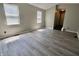 Open bedroom with wood floors and natural light from bright windows at 12115 Flagstone Dr, Fishers, IN 46037