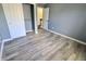 Bedroom featuring new flooring and a closet space for storage at 12115 Flagstone Dr, Fishers, IN 46037