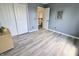 Inviting bedroom with closet space and light wood plank floors offers neutral tones at 12115 Flagstone Dr, Fishers, IN 46037