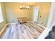 Dining area features stylish flooring, modern light fixture, and ample natural light at 12115 Flagstone Dr, Fishers, IN 46037