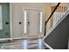 Bright foyer features stylish flooring, and a staircase with elegant banister at 12115 Flagstone Dr, Fishers, IN 46037