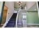 Inviting foyer with stairway, chandelier, and views of a living area with lots of natural light at 12115 Flagstone Dr, Fishers, IN 46037