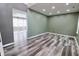 Open-concept living room showcasing stylish flooring, recessed lighting, and neutral walls at 12115 Flagstone Dr, Fishers, IN 46037