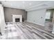 Spacious living room with fireplace, modern flooring, neutral paint, and plenty of natural light at 12115 Flagstone Dr, Fishers, IN 46037