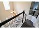 Staircase with gray carpet runners and black railing leads to upper level of home at 12115 Flagstone Dr, Fishers, IN 46037