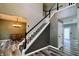 Spacious staircase with stylish flooring, and an elegant chandelier at 12115 Flagstone Dr, Fishers, IN 46037