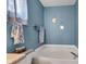 Cozy bathroom featuring a built-in bathtub with tile surround and modern fixtures at 12256 Sagamore Woods Dr, Fishers, IN 46037
