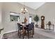 Bright dining area with a chandelier, seamlessly connected to the living spaces, perfect for Gathering meals at 12256 Sagamore Woods Dr, Fishers, IN 46037