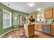 Cozy kitchen featuring bright green walls and functional appliances at 12256 Sagamore Woods Dr, Fishers, IN 46037