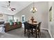 Open-concept living room with a fireplace and seamless flow into the dining area, perfect for entertaining at 12256 Sagamore Woods Dr, Fishers, IN 46037
