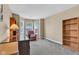 Spacious room with neutral walls, carpet, bay window, a lamp and a bookcase at 12256 Sagamore Woods Dr, Fishers, IN 46037