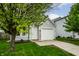 Charming home featuring a well-manicured lawn and an attached one car garage at 1242 Freemont Ln, Greenwood, IN 46143