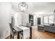 Open living area boasts a modern fireplace, comfortable seating, and a dining area at 1242 Freemont Ln, Greenwood, IN 46143