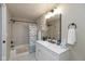 Bathroom features updated vanity and shower with stylish curtain at 129 Rosewood Dr, Cicero, IN 46034