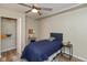 Bedroom featuring a desk, ceiling fan, and closet at 129 Rosewood Dr, Cicero, IN 46034