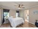 Cozy bedroom features a ceiling fan and ensuite bathroom at 129 Rosewood Dr, Cicero, IN 46034