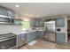 Beautiful kitchen with stainless steel appliances and gray cabinetry at 129 Rosewood Dr, Cicero, IN 46034