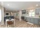 Open concept kitchen with stainless steel appliances and a dining area at 129 Rosewood Dr, Cicero, IN 46034
