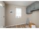 A well-lit laundry area features storage and a window at 129 Rosewood Dr, Cicero, IN 46034