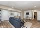 Inviting living room with wood floors, neutral walls, and a comfortable blue sofa at 129 Rosewood Dr, Cicero, IN 46034
