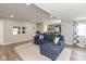 Open concept living space featuring wood floors and a view into the kitchen at 129 Rosewood Dr, Cicero, IN 46034