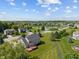 Aerial view of a backyard with a deck, situated in a neighborhood near a pond at 13553 Lorenzo Blvd, Carmel, IN 46074