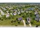 A beautiful aerial view of a residential community with lush greenery and a serene lake at 13553 Lorenzo Blvd, Carmel, IN 46074