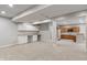Spacious finished basement with wet bar, and views into kitchenette space at 13553 Lorenzo Blvd, Carmel, IN 46074