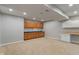 Spacious finished basement area featuring ample cabinet storage and neutral walls at 13553 Lorenzo Blvd, Carmel, IN 46074