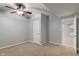 Neutral bedroom featuring a ceiling fan, doorway, and closet space at 13553 Lorenzo Blvd, Carmel, IN 46074