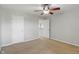Bright bedroom with ceiling fan and multiple entrances at 13553 Lorenzo Blvd, Carmel, IN 46074