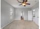 Spacious bedroom with ceiling fan, and access to bathroom and other living spaces at 13553 Lorenzo Blvd, Carmel, IN 46074
