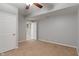 Neutral bedroom featuring a ceiling fan, doorway, and closet space at 13553 Lorenzo Blvd, Carmel, IN 46074