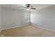 Neutral bedroom with ceiling fan and window view at 13553 Lorenzo Blvd, Carmel, IN 46074