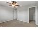 Neutral bedroom features a ceiling fan, doorway, and closet space at 13553 Lorenzo Blvd, Carmel, IN 46074