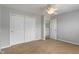 Neutral bedroom featuring a ceiling fan, closet, and doorway leading to another room at 13553 Lorenzo Blvd, Carmel, IN 46074