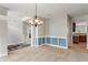 Elegant dining area with wainscoting, chandelier, and neutral color scheme at 13553 Lorenzo Blvd, Carmel, IN 46074