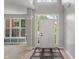 Bright foyer with high ceilings, decorative rug, and view to the living area at 13553 Lorenzo Blvd, Carmel, IN 46074