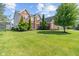 Beautiful two-story brick home with manicured lawn and tasteful landscaping at 13553 Lorenzo Blvd, Carmel, IN 46074