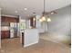 Open concept kitchen with stainless steel appliances and bar seating at 13553 Lorenzo Blvd, Carmel, IN 46074
