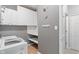 Modern laundry room with storage cabinets and countertop at 13553 Lorenzo Blvd, Carmel, IN 46074