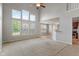 Spacious living room with soaring windows, neutral decor, and open floor plan at 13553 Lorenzo Blvd, Carmel, IN 46074