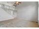 Bright living room with high ceilings, staircase, and neutral carpeting at 13553 Lorenzo Blvd, Carmel, IN 46074