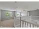 Open loft area with ample natural light and white railing at 13553 Lorenzo Blvd, Carmel, IN 46074