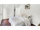 A cozy bedroom featuring hardwood floors, neutral decor, and ample closet space at 1434 Laurel St, Indianapolis, IN 46203